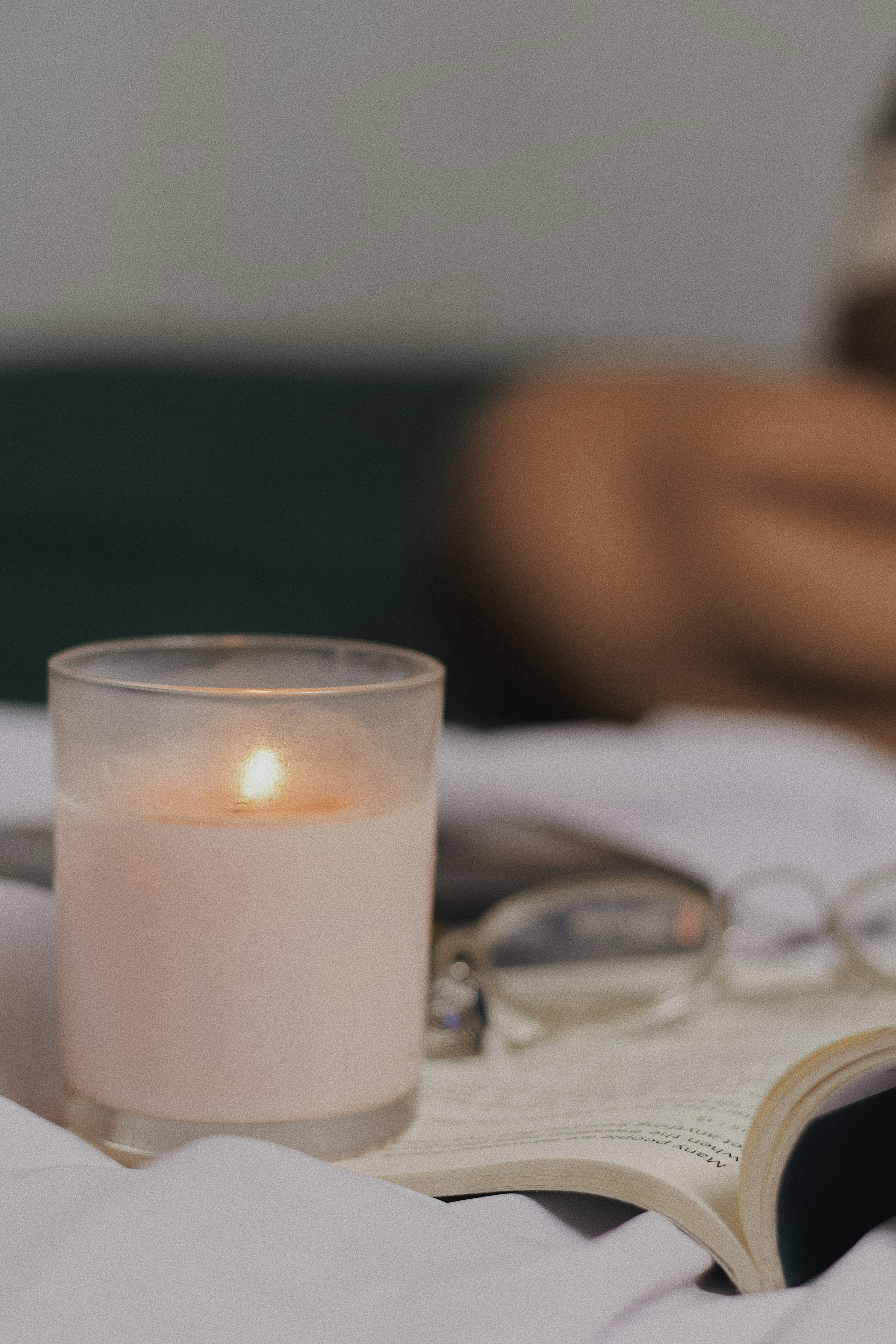 white candle on white table